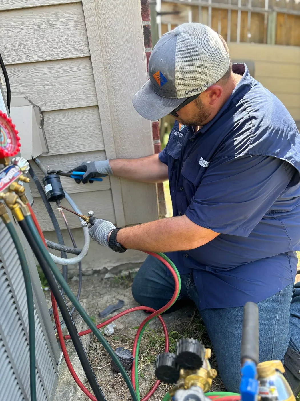 HVAC technician performing AC repair